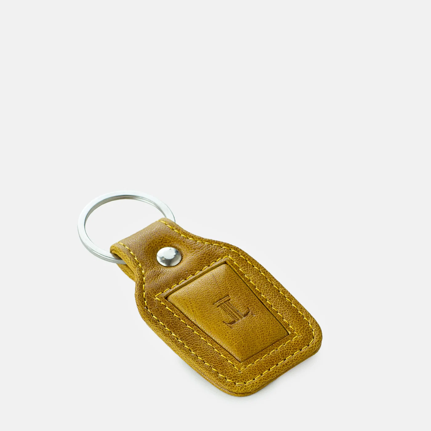 leatherkeychain mustardcolor sideview julke leatherkeychain mustardcolor sideview julke