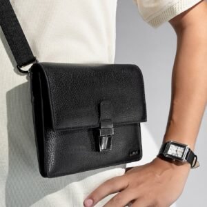 warbler mens crossbody travel bag black metal push lock flap detachable shoulder strap three quarter view julke