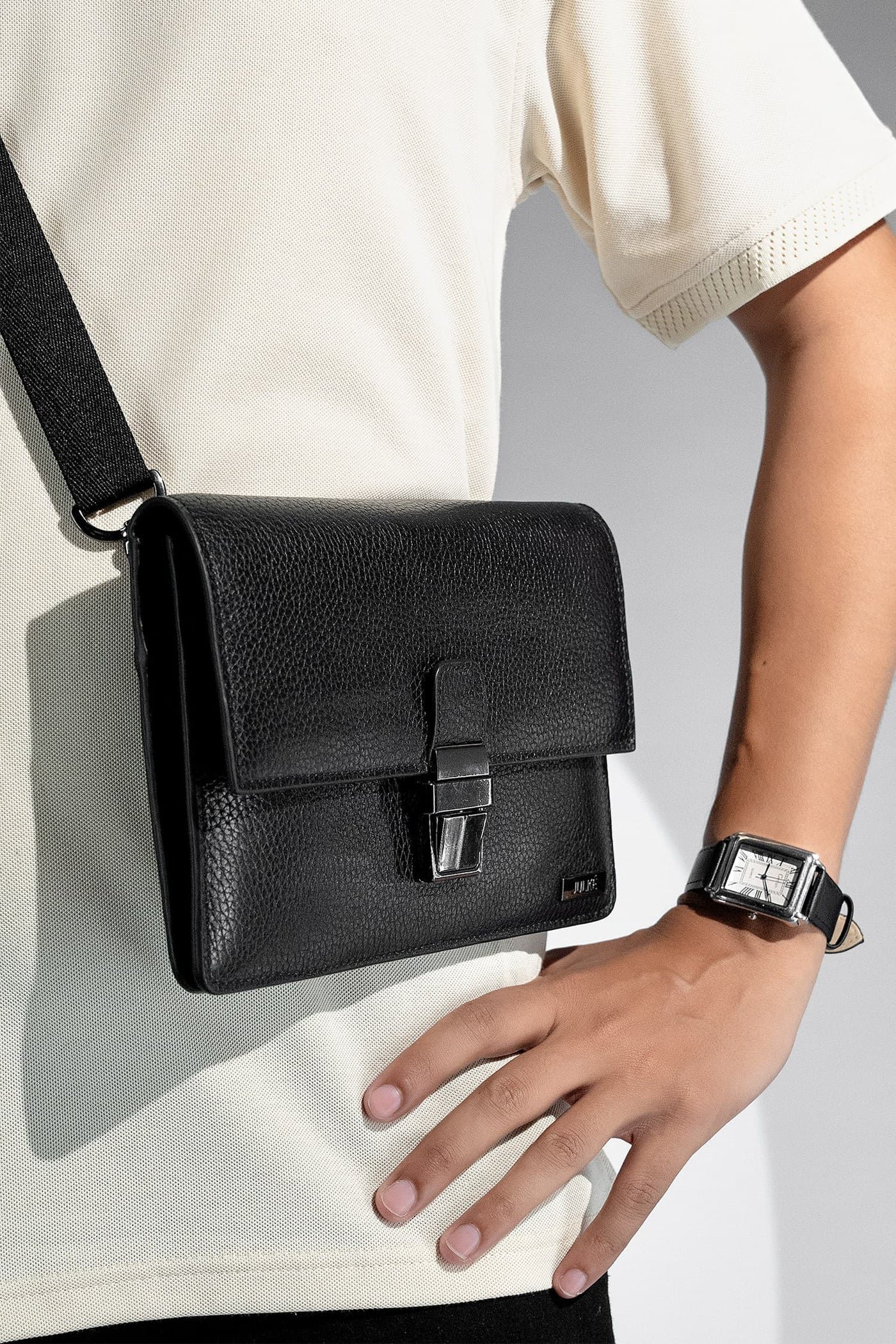 warbler mens crossbody travel bag black metal push lock flap detachable shoulder strap three quarter view julke warbler mens crossbody travel bag black metal push lock flap detachable shoulder strap three quarter view julke